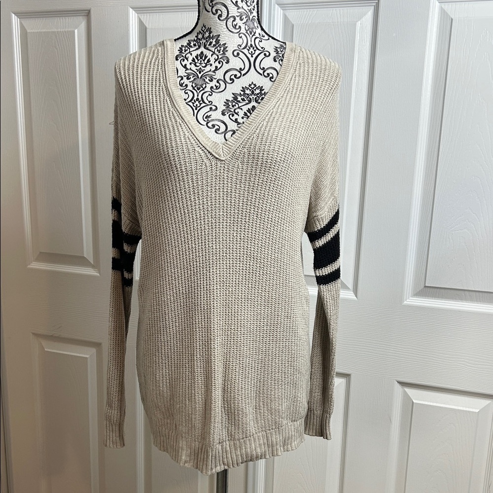 Beige V-Neck Sweater with Black Stripes‎